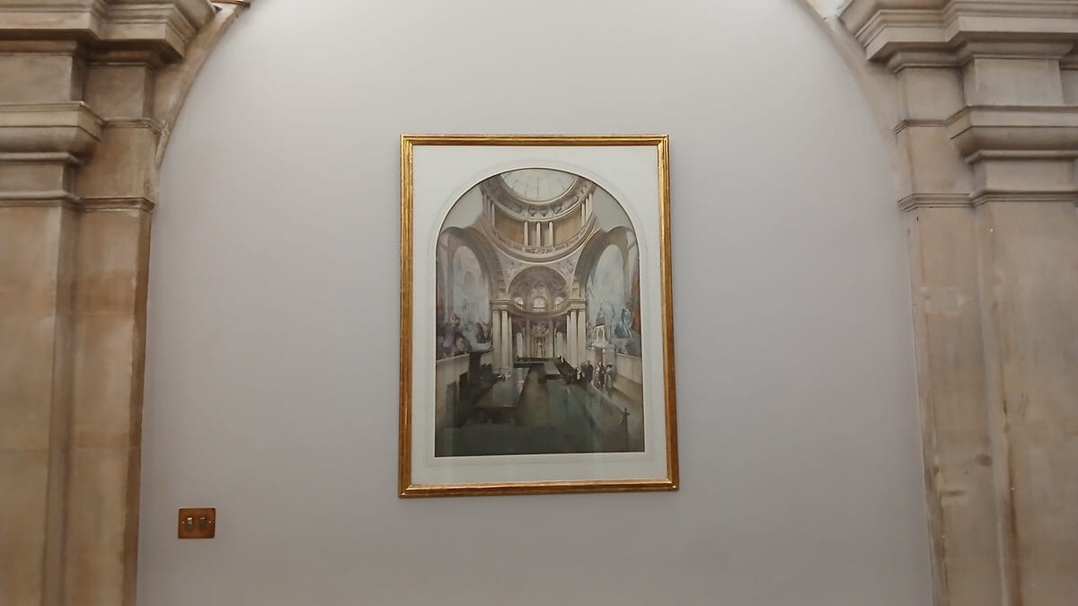 a picture of  a painting hanging on a wall in an archway