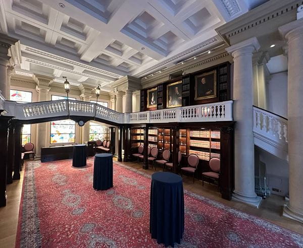 Picture of an ornate room with turkish carpet and book shelves