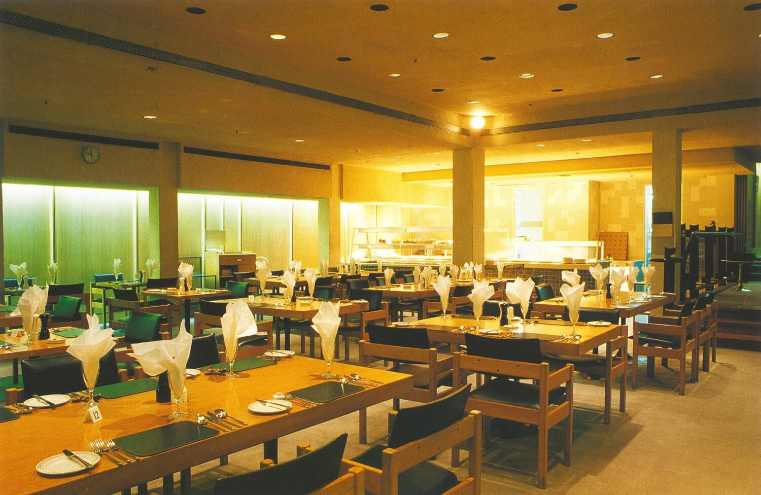 a picture of an empty restaurant with wooden tables and chairs