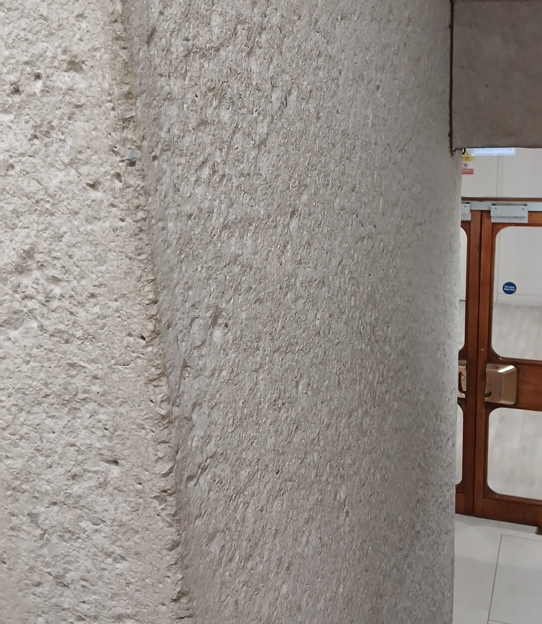 a picture of a rough concrete interior wall