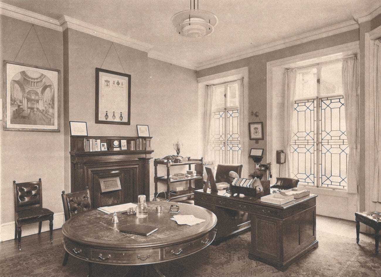 A black and white photograph of an office in the 1930s