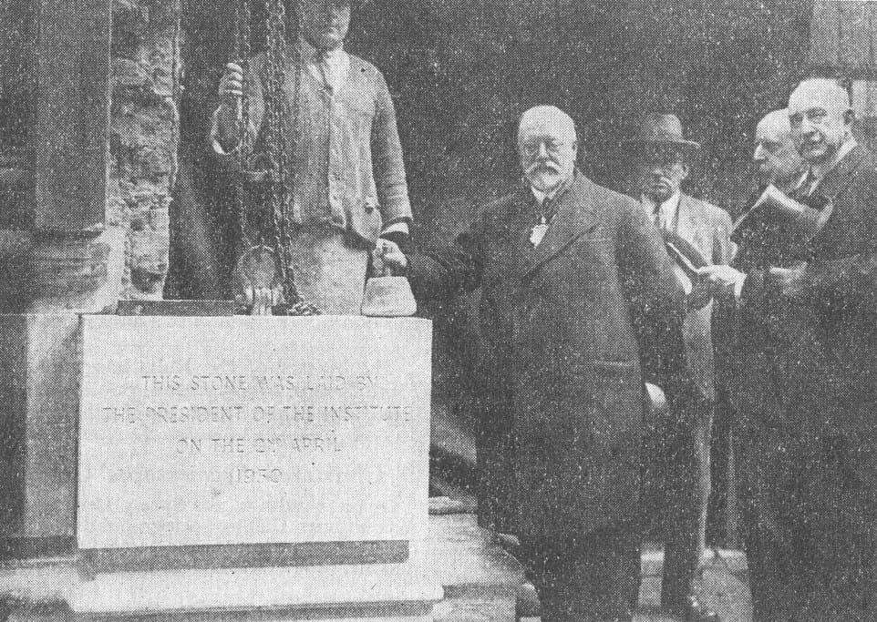 Vintage black and white photograph of a foundation stone being laid