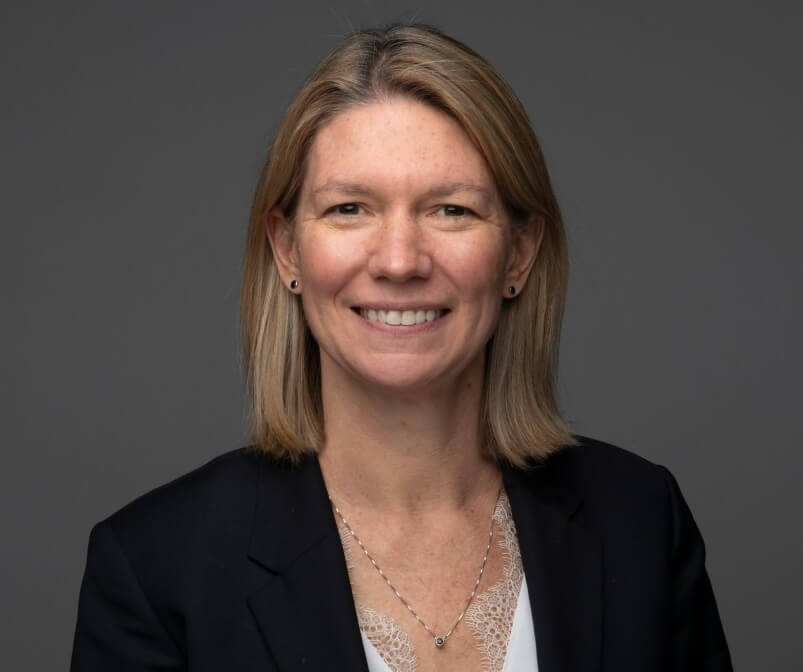 Headshot a a woman looking straight at camera