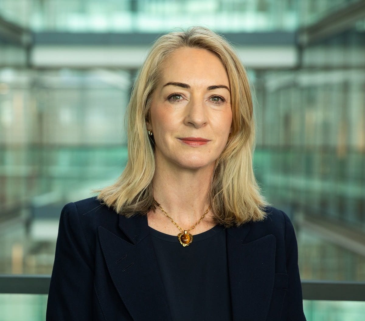 Headshot a a woman looking straight at camera