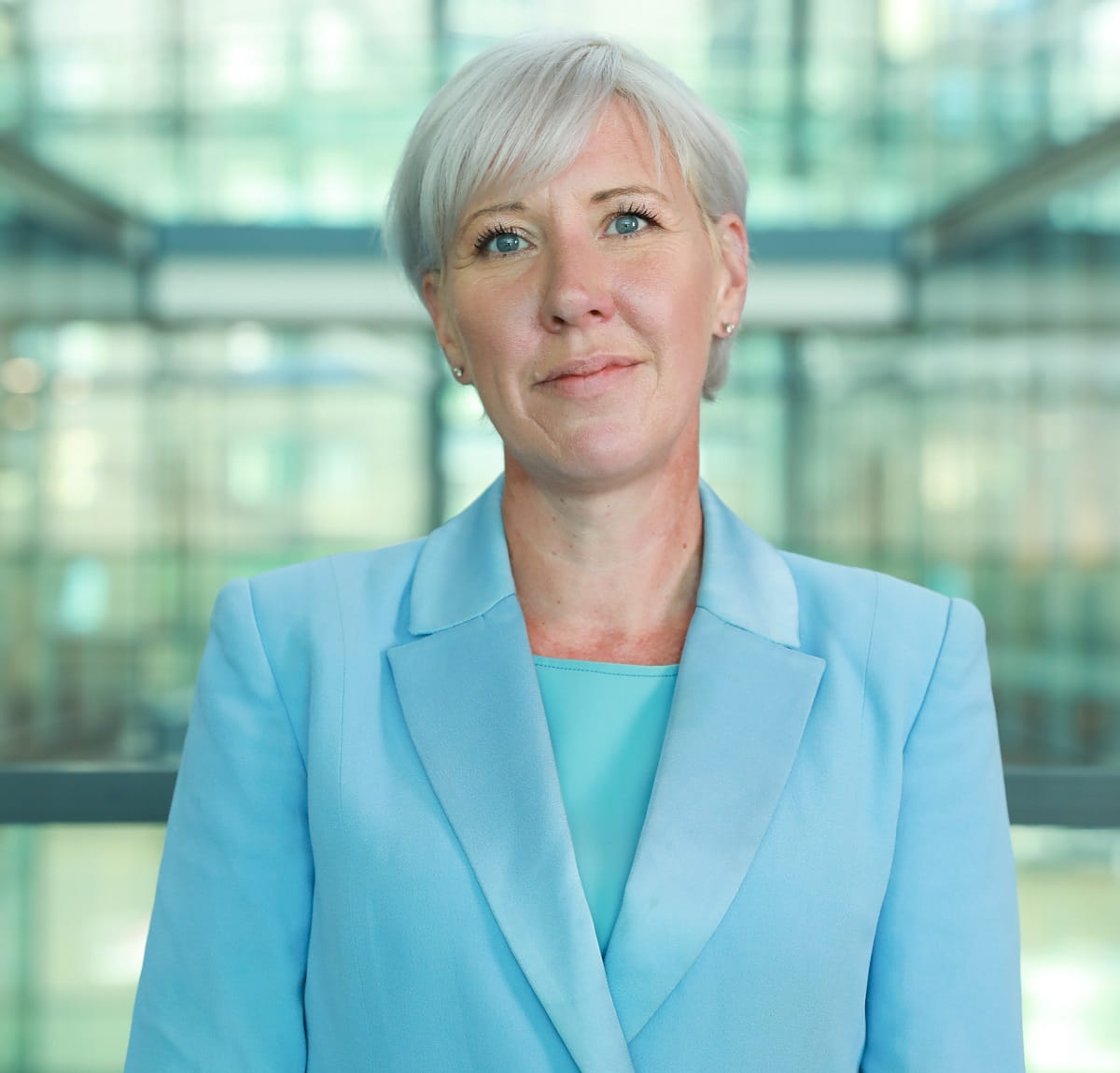 Headshot a a woman looking straight at camera