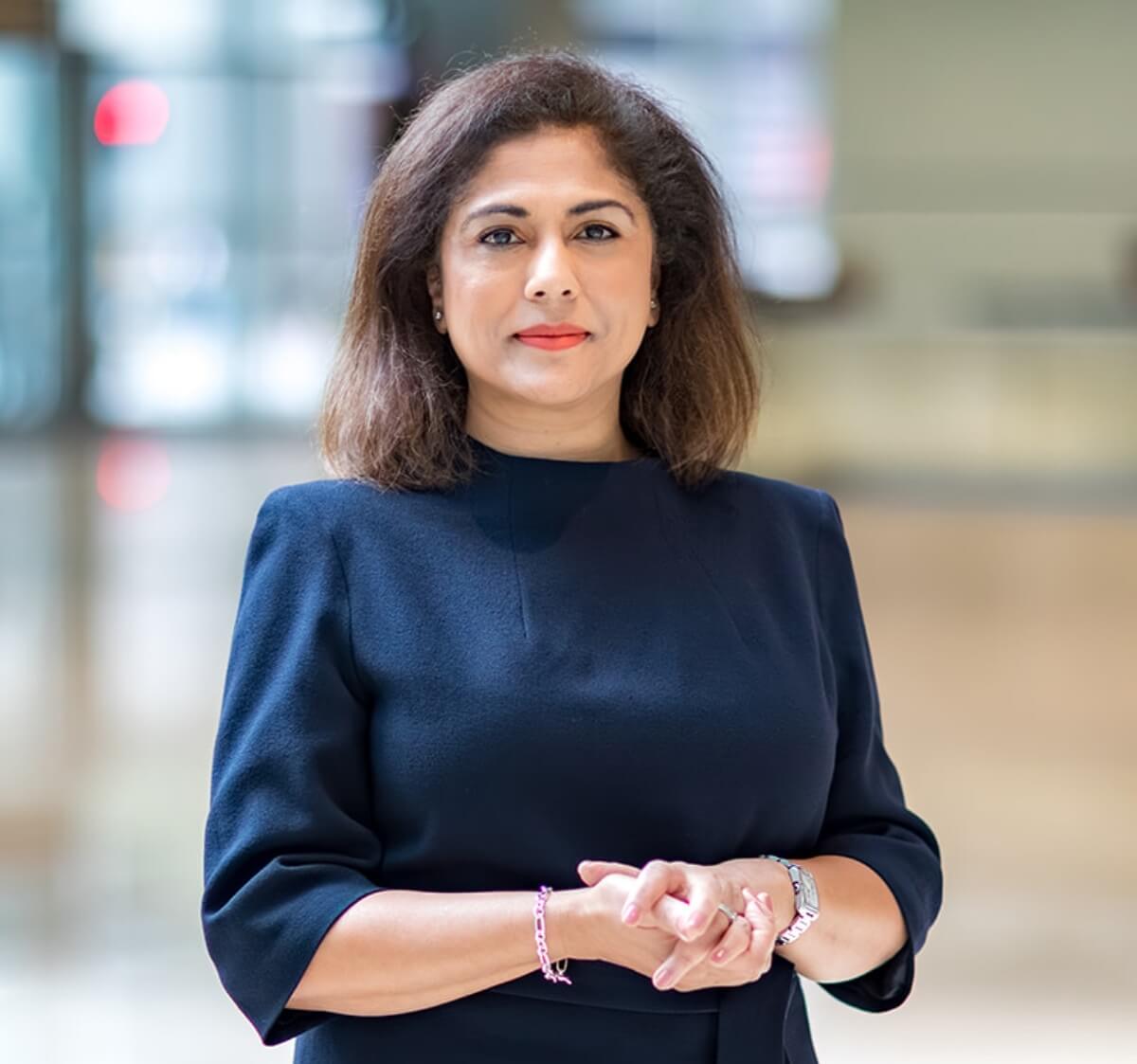 Headshot a a woman looking straight at camera