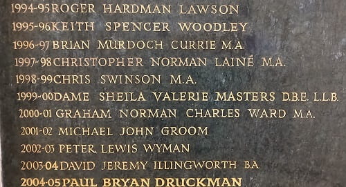 Image of a plaque with gold embossed names and dates