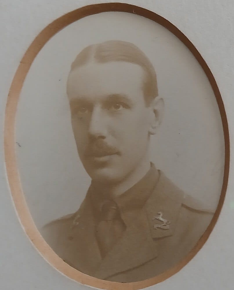 Vintage photograph headshot of a young man in army uniform