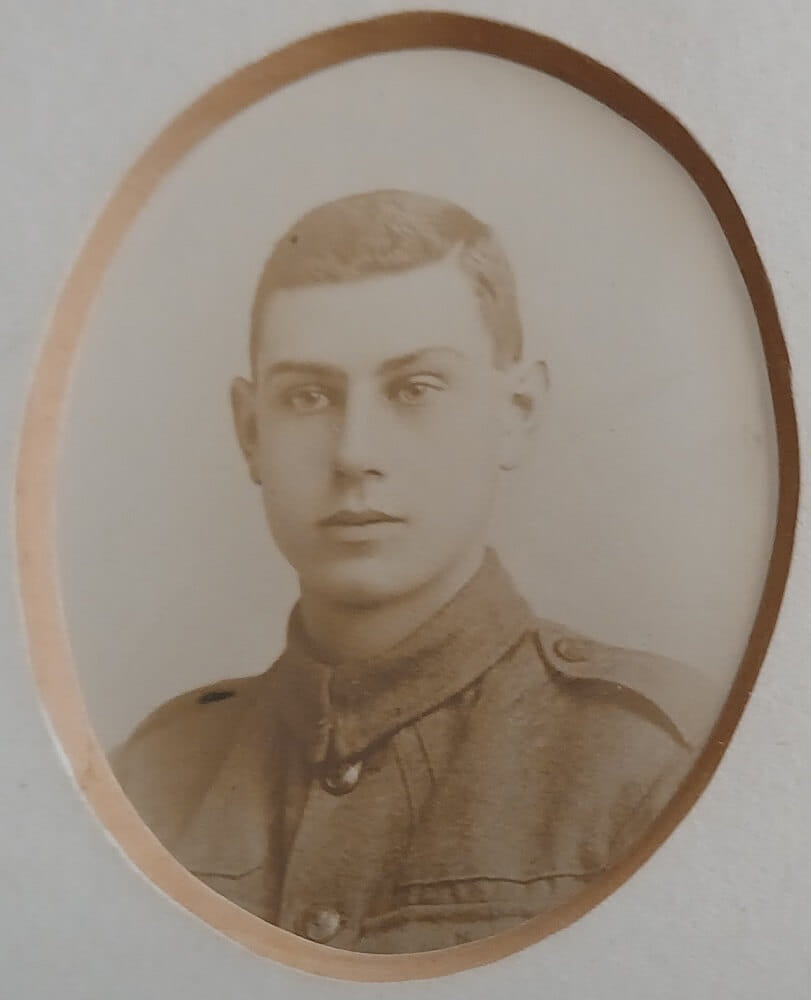 Vintage photograph headshot of a young man in army uniform