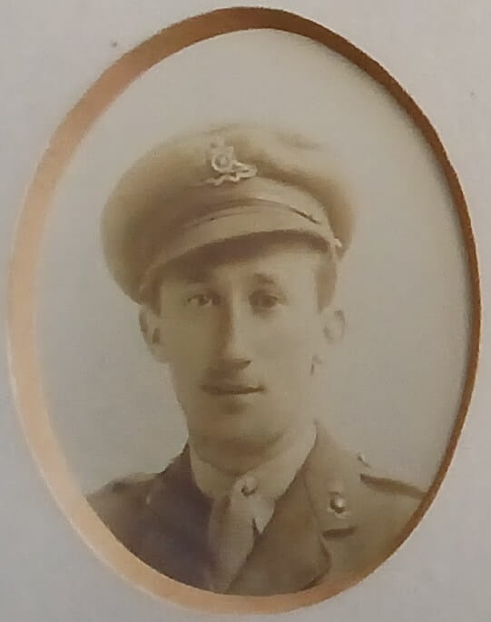 Vintage photograph headshot of a young man in army uniform