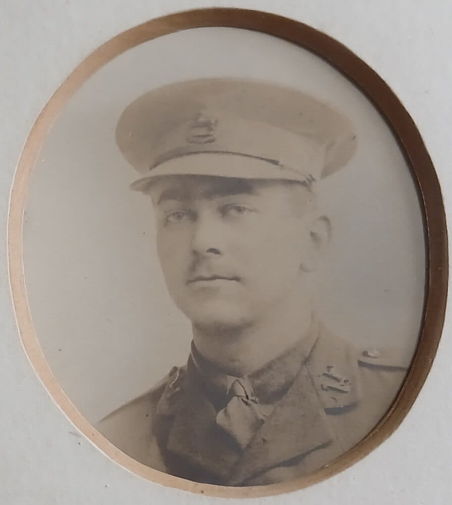 Vintage photograph headshot of a young man in army uniform