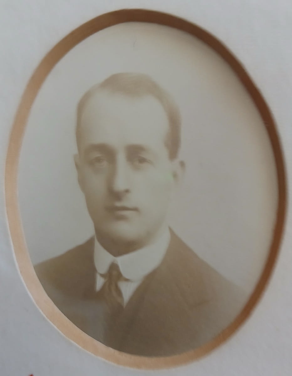 Vintage photograph headshot of a young man in army uniform