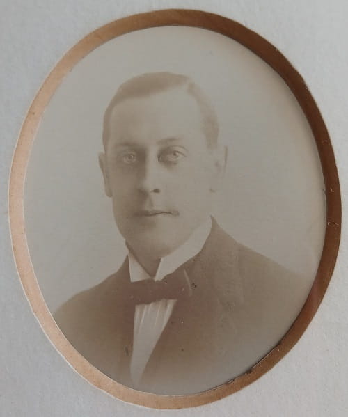 Vintage photograph headshot of a young man in formal dress