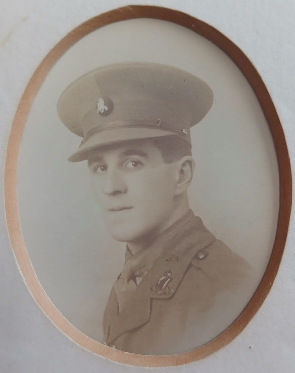 Vintage photograph headshot of a young man in army uniform