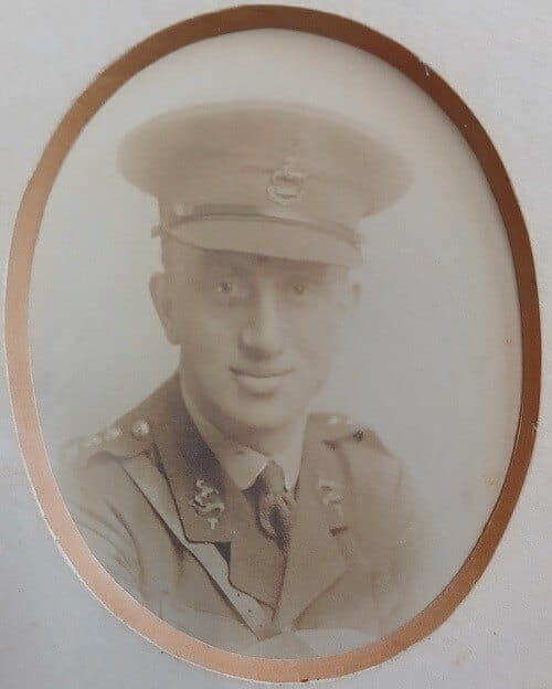 Vintage photograph headshot of a young man in army uniform