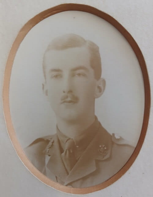 Vintage photograph headshot of a young man in army uniform