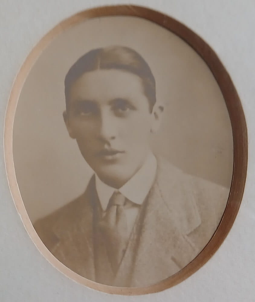 Vintage photograph headshot of a young man in army uniform