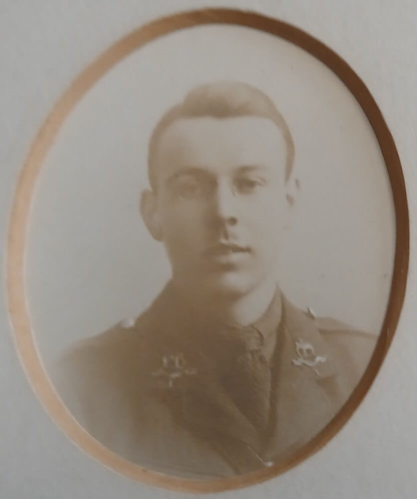 Vintage photograph headshot of a young man in army uniform