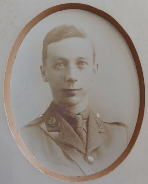 Vintage photograph headshot of a young man in army uniform