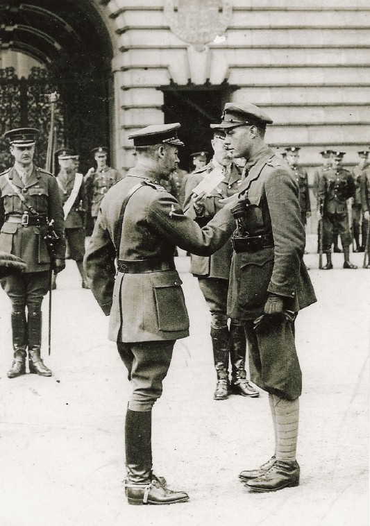 Vintage photograph of an officer being awarded a medal by the king in world war one