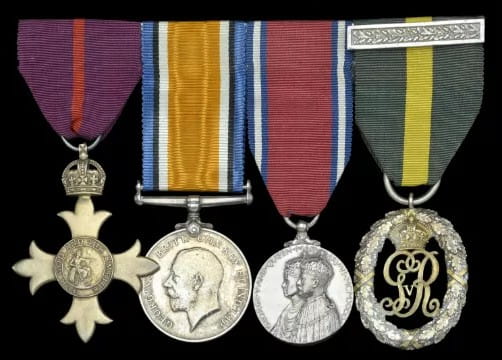 a collection of military medals with bright ribbons