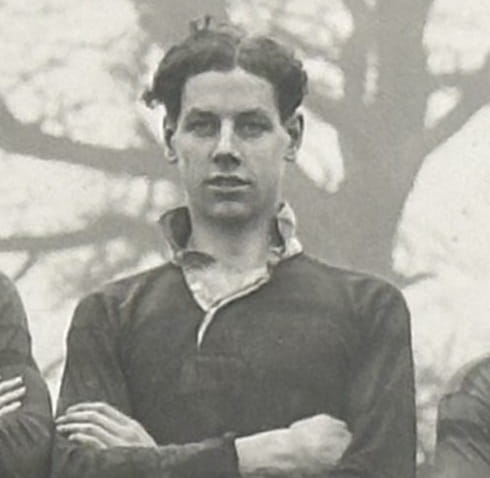 Vintage 1930's photograph of a man standing in rugby shirt, arms folded (detail from a Rugby club, photograph)