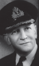 Headshot of a man in a Naval officers uniform