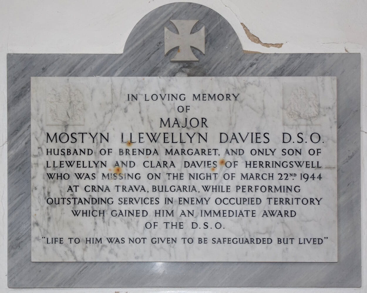 Memorial plaque on the wall inside a church