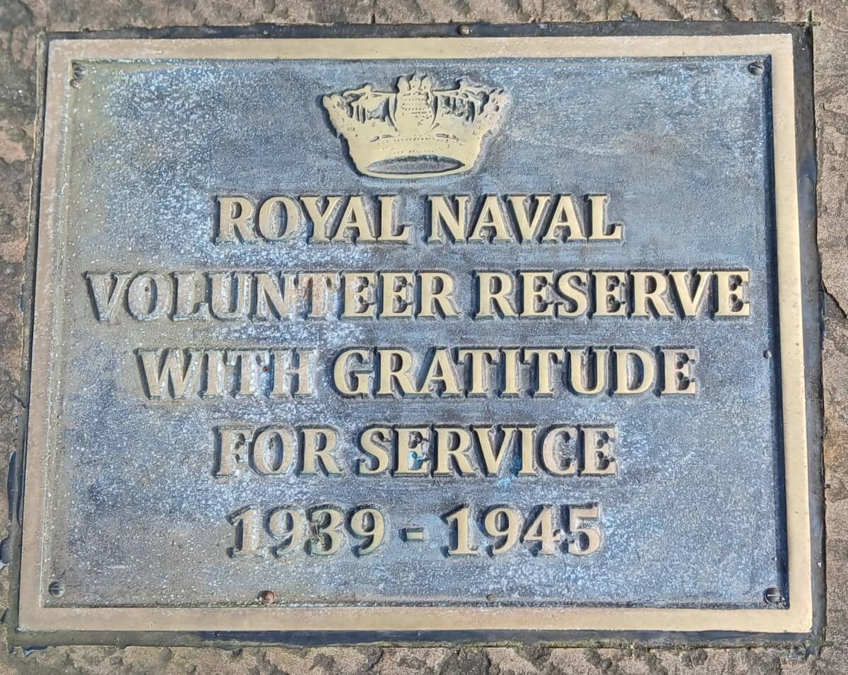 Photograph of a memorial plaque in a church yard