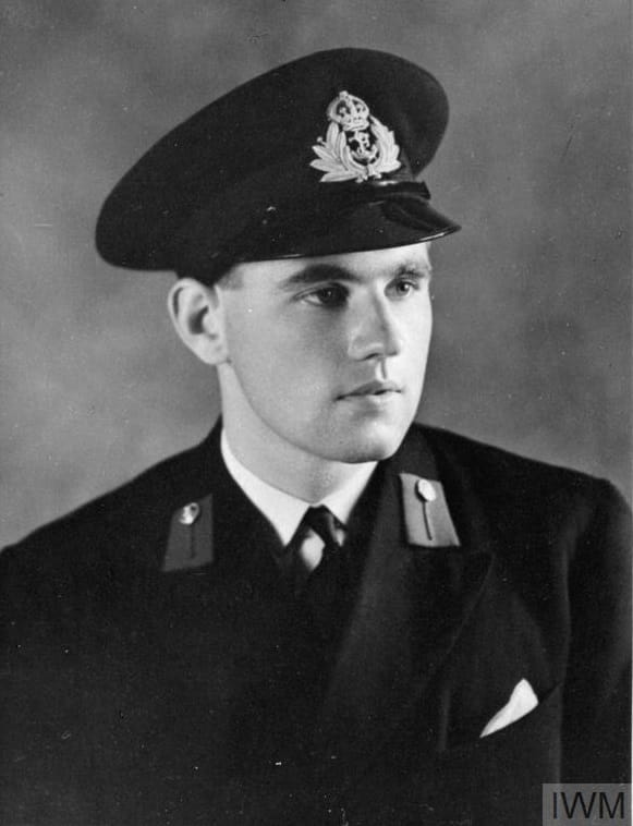 Head shot of a man in a Royal Navy midshipman's uniform