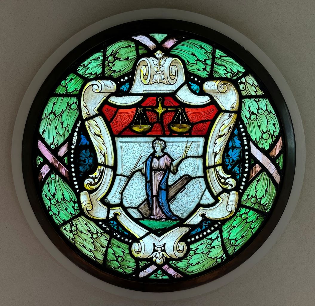 A close up photograph of one of the roundels as it exists today, installed at the entrance to the One Moorgate Place Club.
