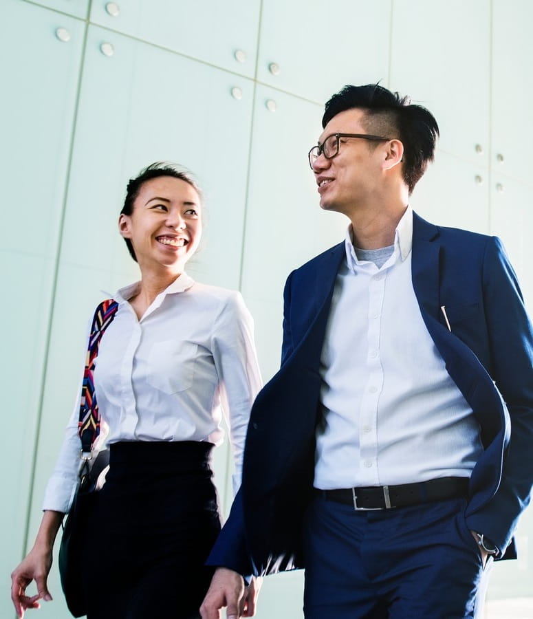 Two colleagues walking and discussing