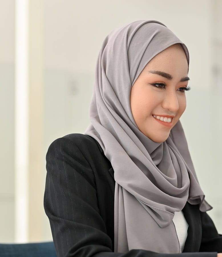 Young businesswoman working on a laptop at her desk in the office.