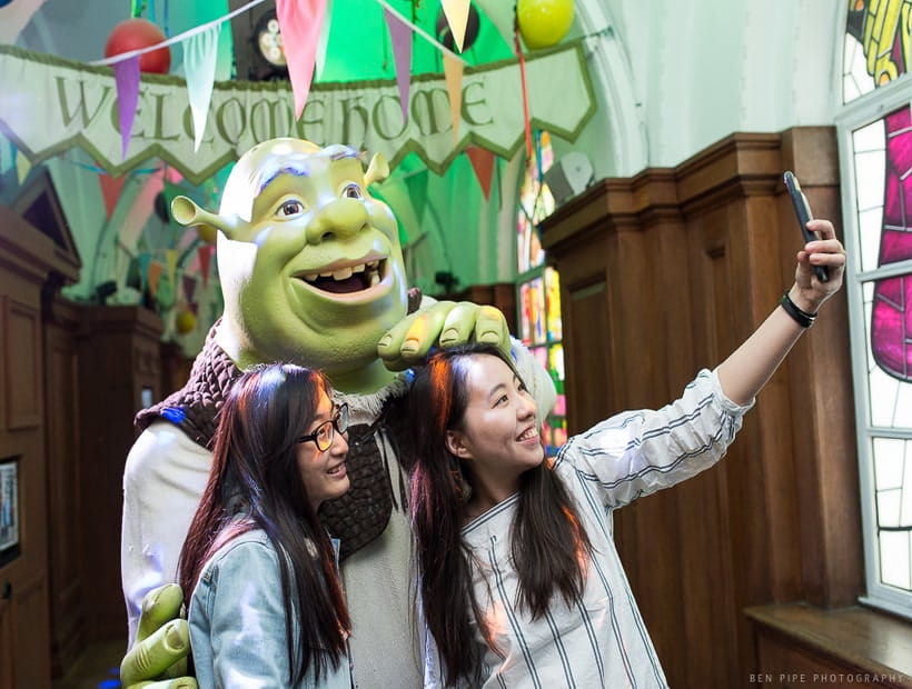 Visitors taking a selfie at Merlin Shrek's Adventure London