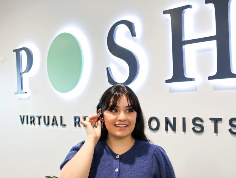 Image of a smiling receptionist on a call