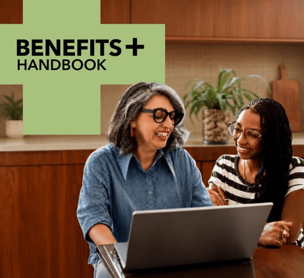 Benefits plus more from your membership. Two smiling women looking at a laptop screen.