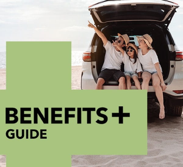 Benefits plus more from your membershipt. A family sitting on the edge of the boot in an open hatchback car parked on a beach