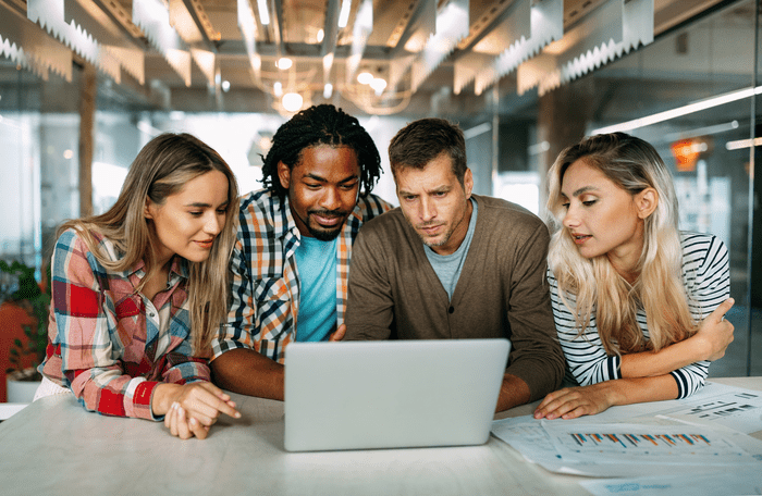 Colleagues looking at laptop