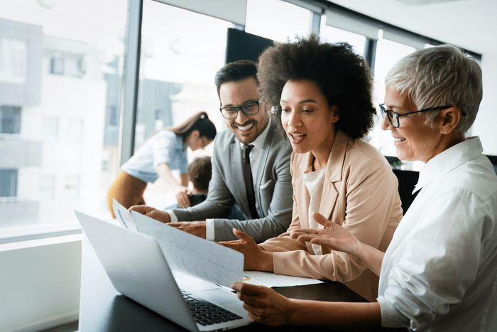 People looking at document