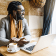 Businessman using his laptop in a coffee shop