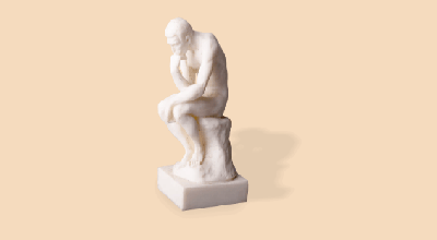 Statue of man thinking