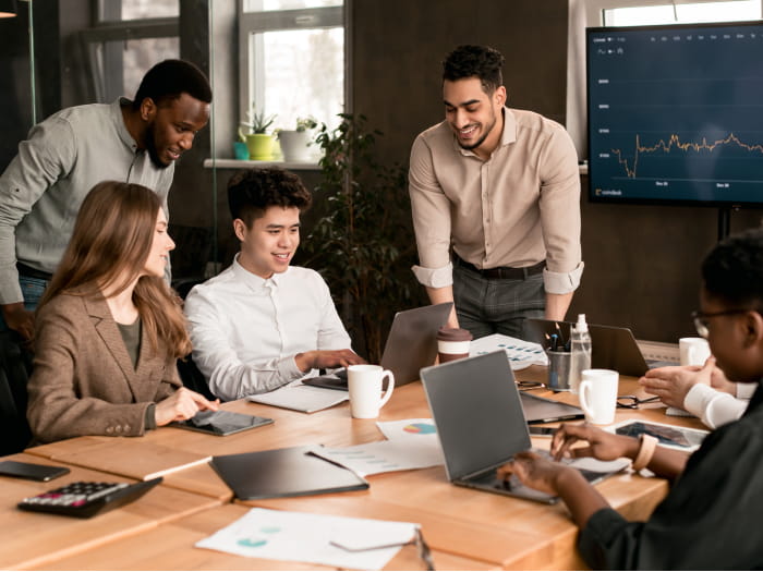 Four people having a discussion around the table