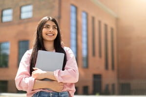Girl holding laptop