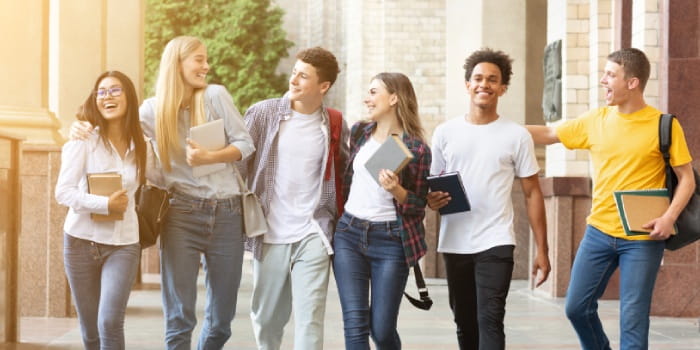 Group of students walking through campus