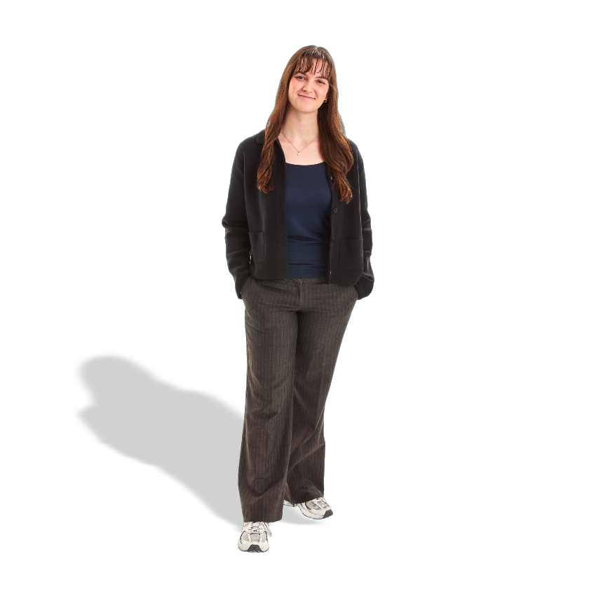 Woman standing hands in pockets