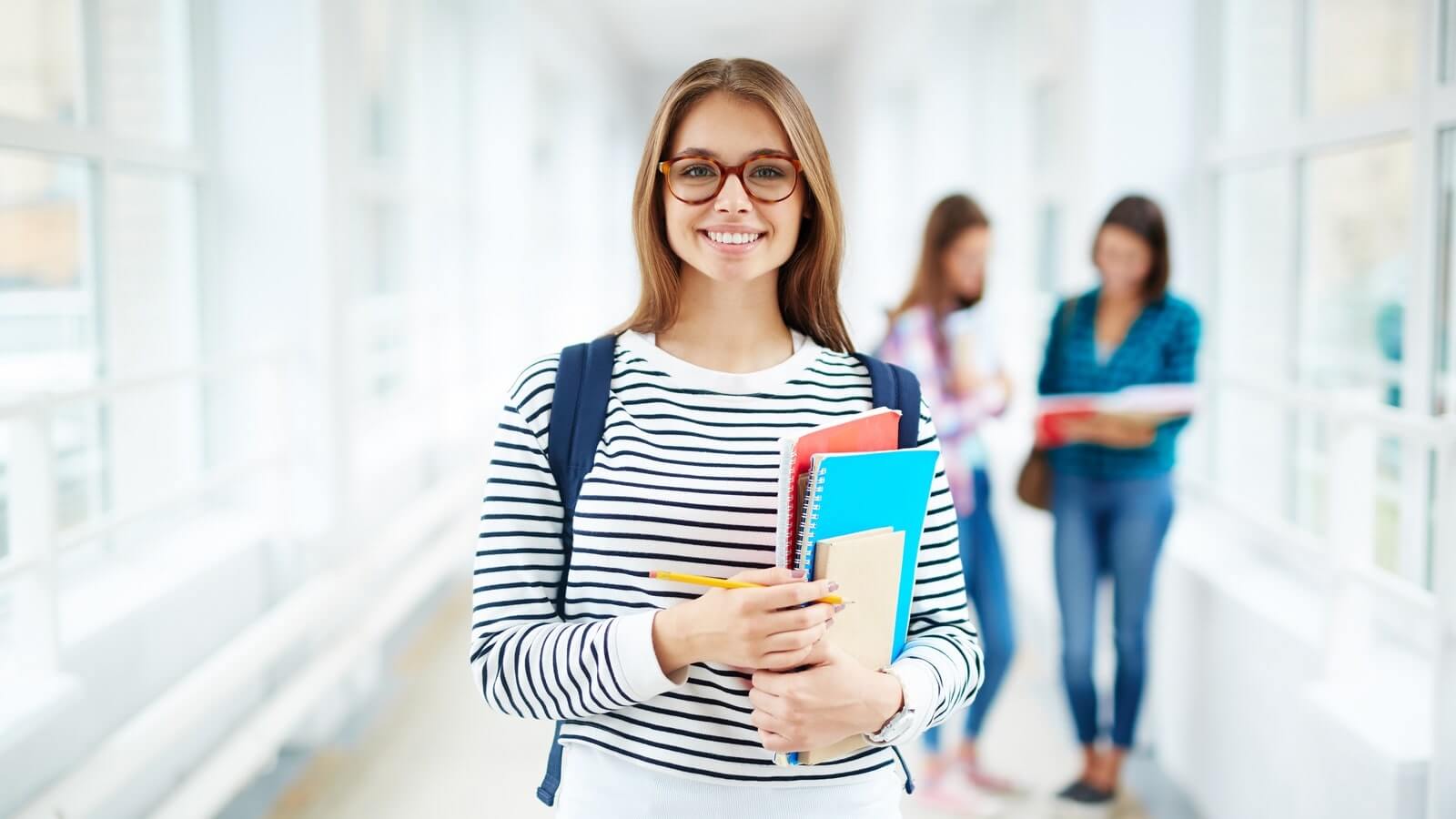 Portrait of female college student smiling at camera