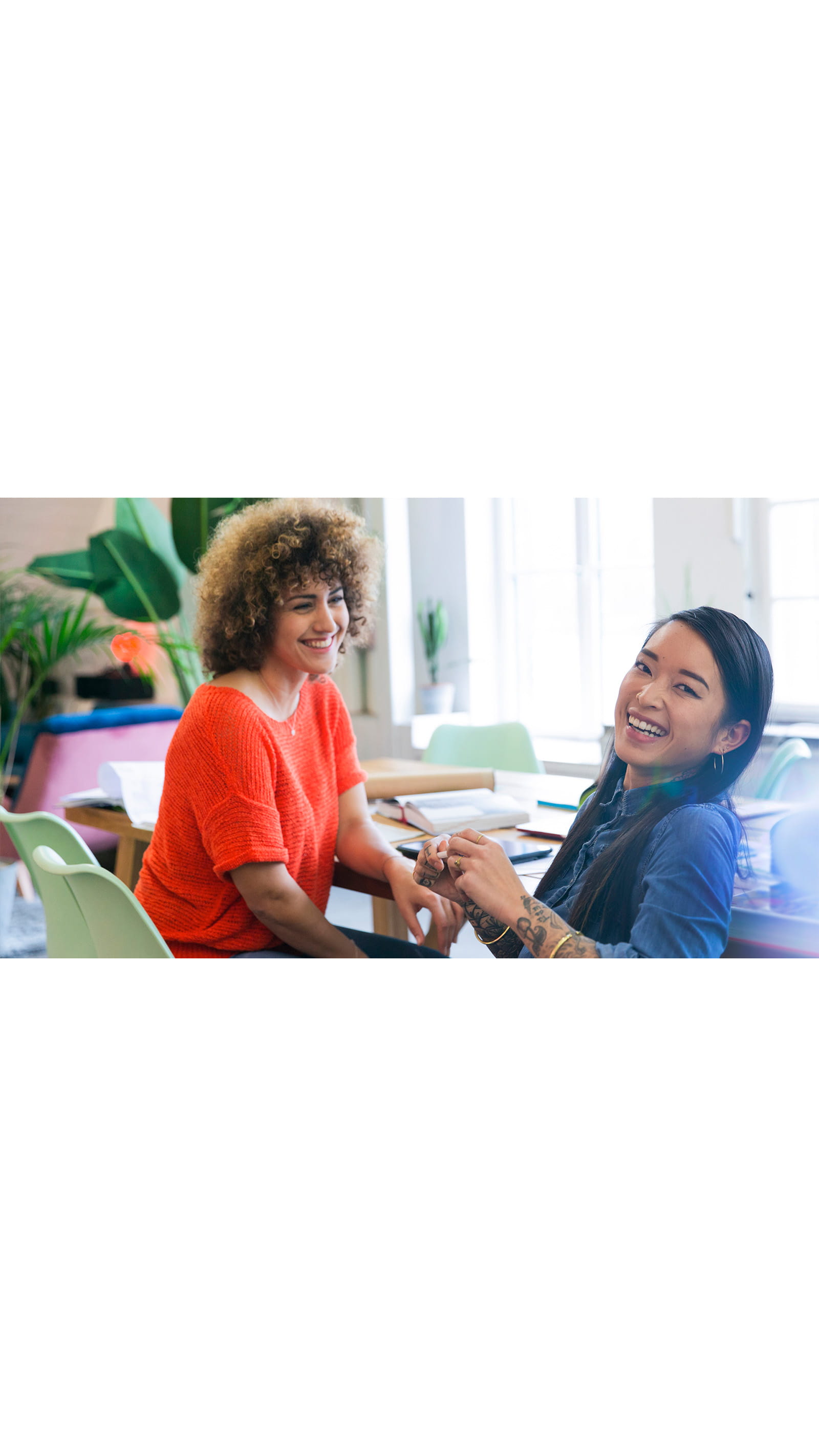 young women office meeting orange blue ICAEW Students benefits