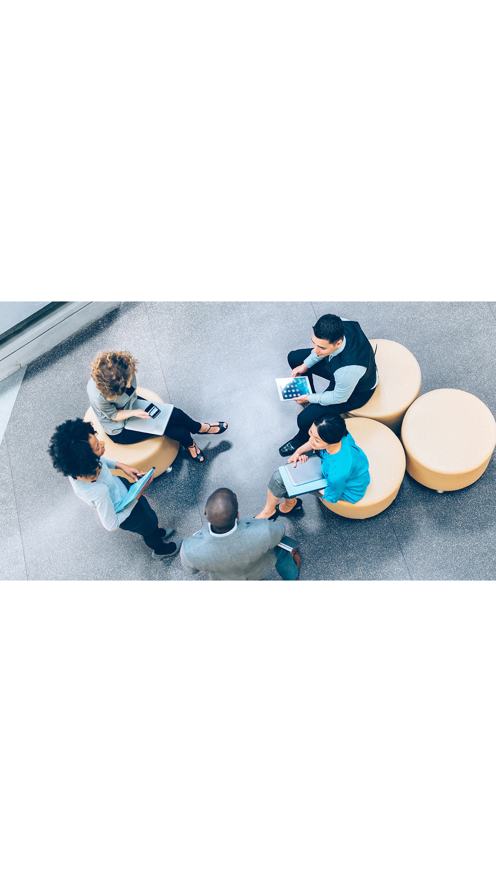informal meeting office sitting young people men women tablet phone laptop ICAEW Students role models