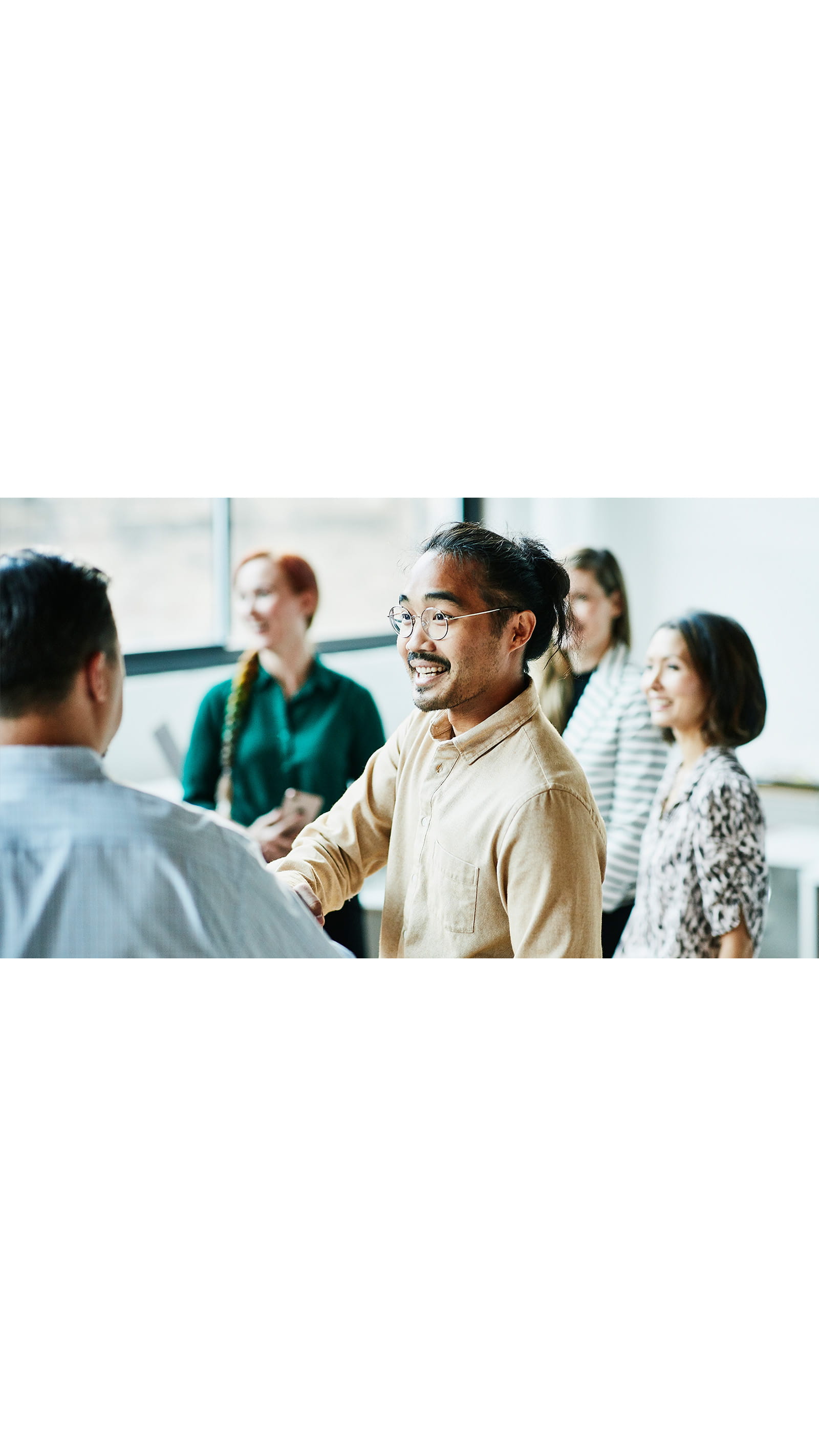group meeting office coworkers colleagues shaking hands new starters ICAEW Students