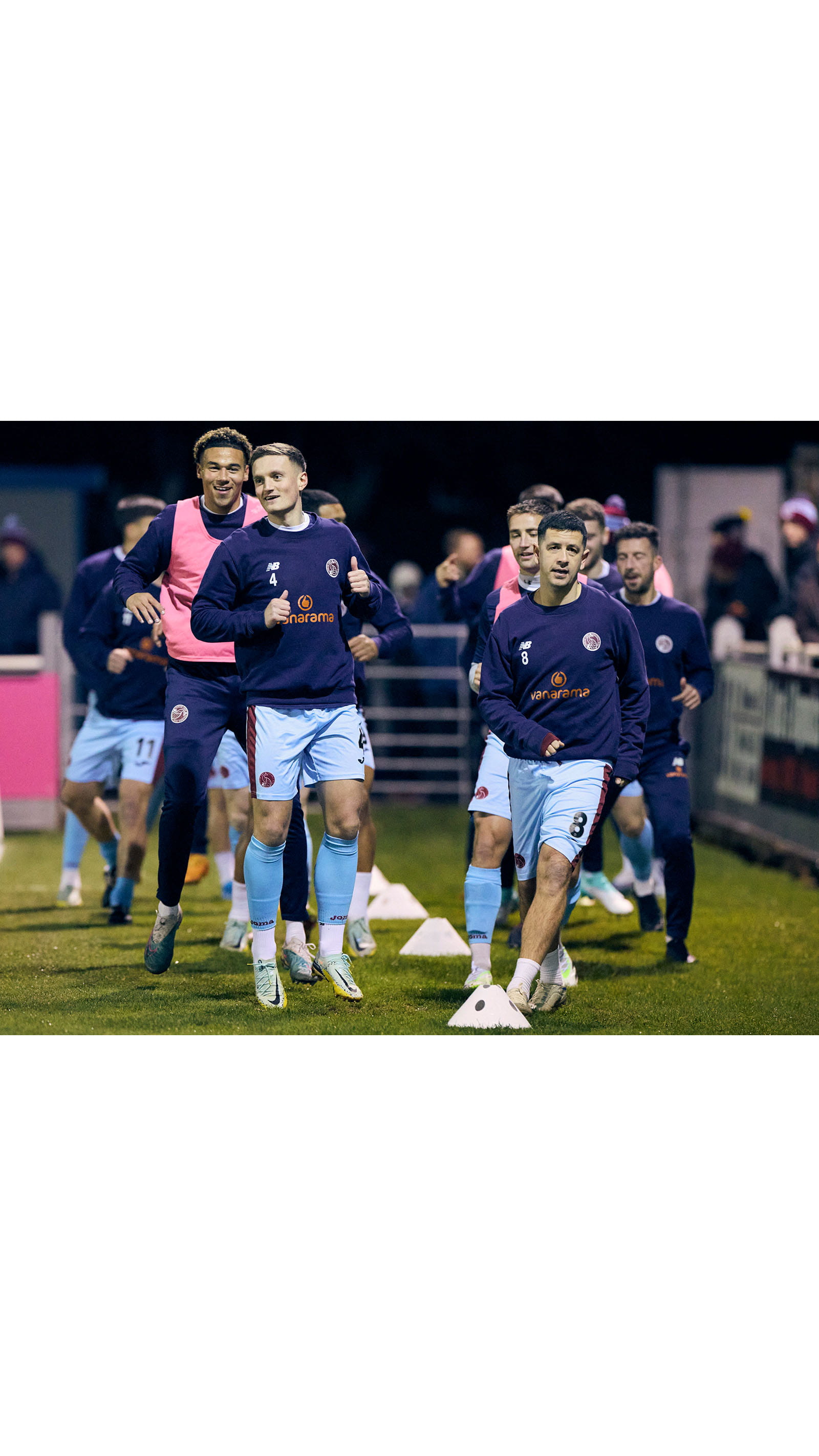 Nick Grimes ACA captain Taunton Town Football Club stadium field players warming up game match